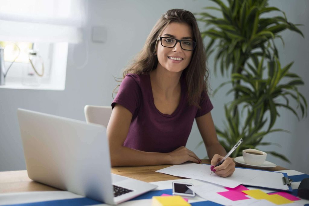 Woman working on a laptop in a modern office