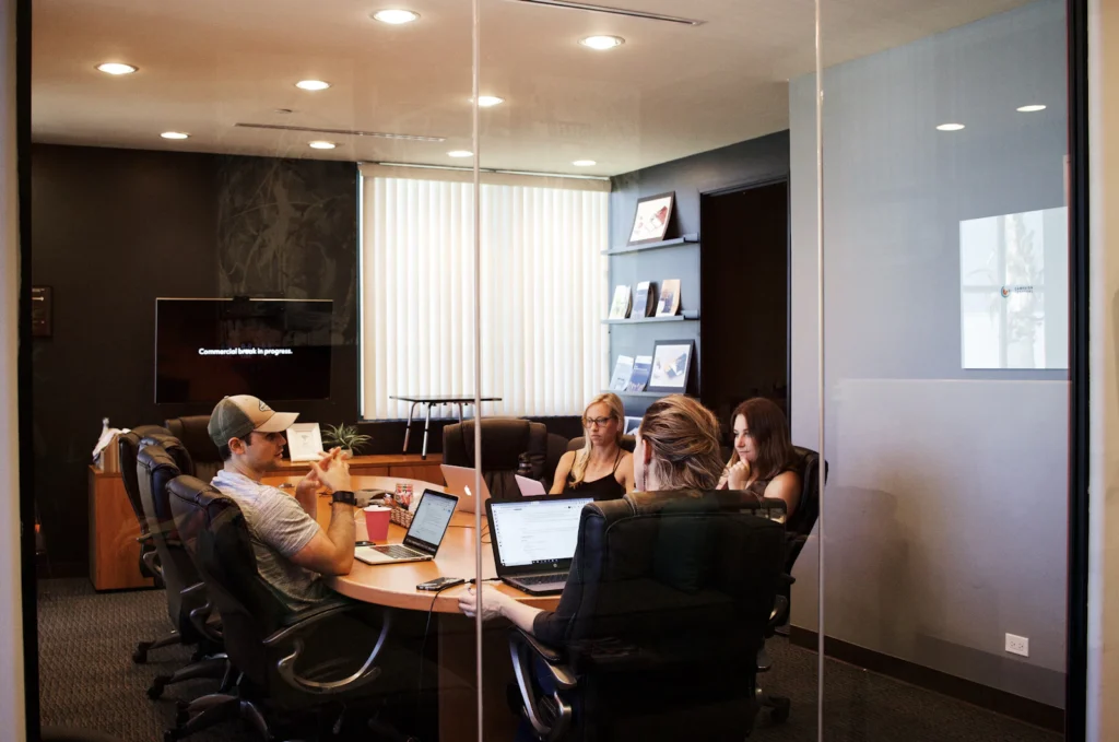 Small business owners meeting with a laptop to plan IT