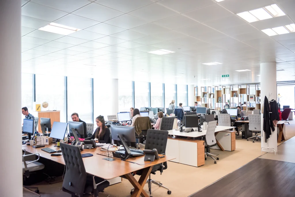 Small business team working in an open office with IT support